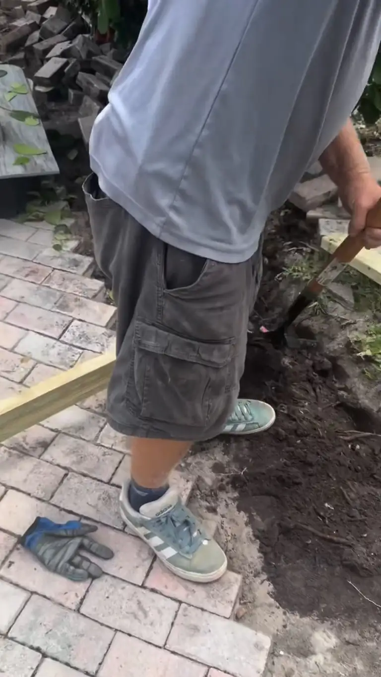 Crew breaking an old concrete slab into pieces