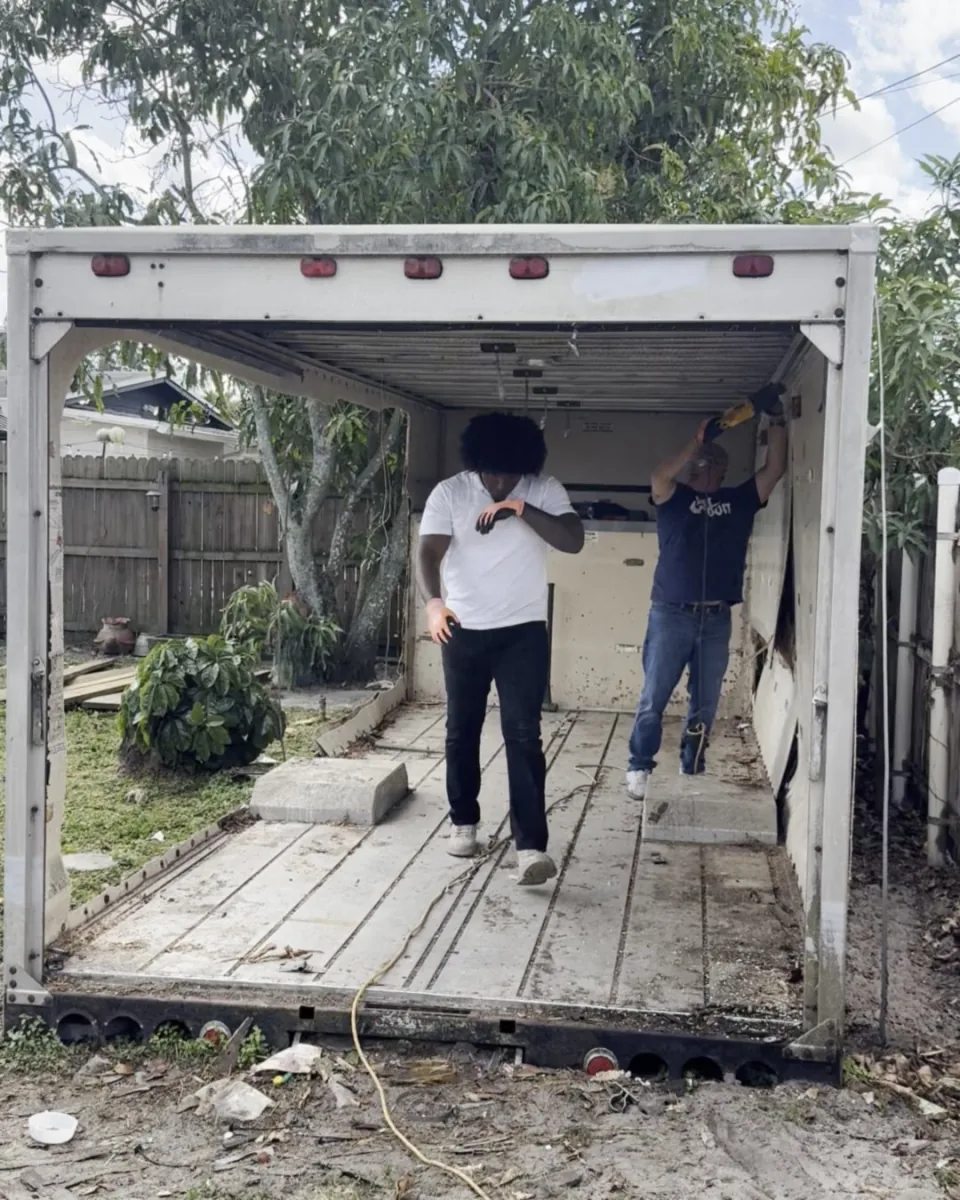 Crew tearing apart the box-truck shed