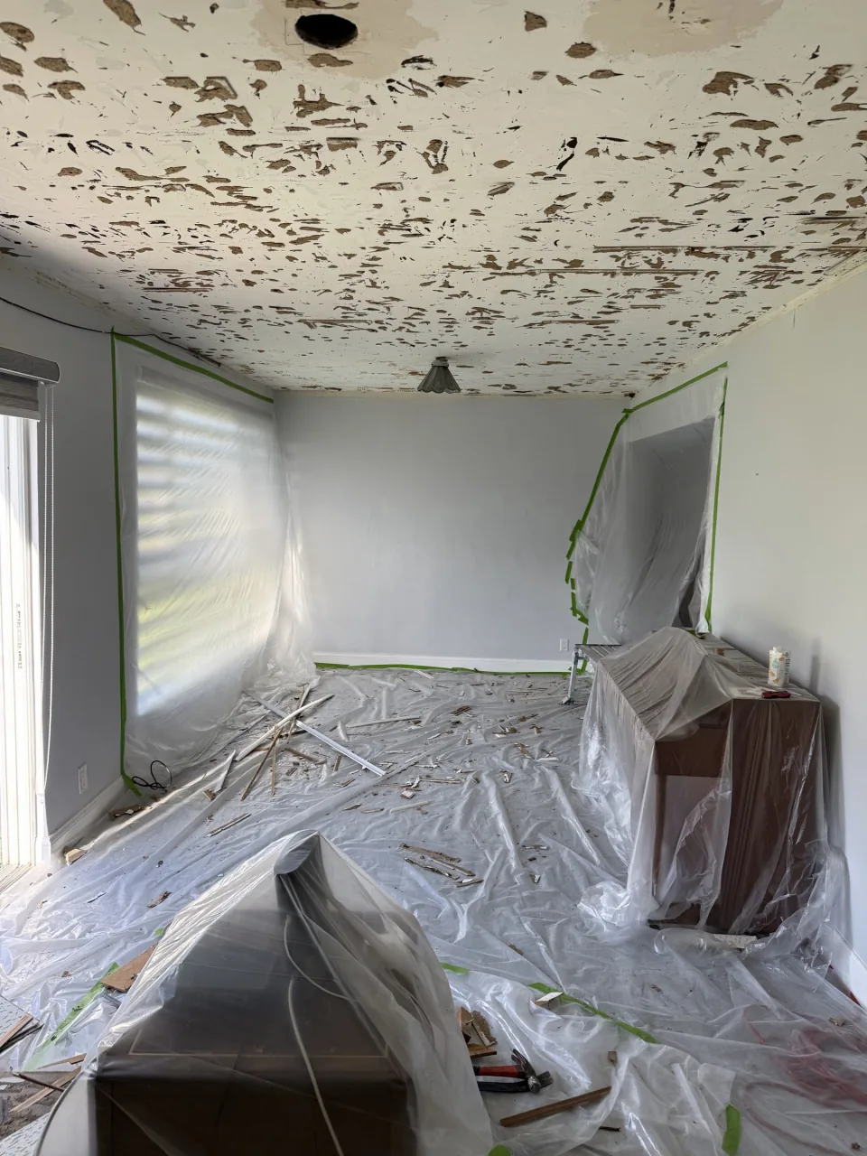 Empty room swept down to the slab after interior demolition