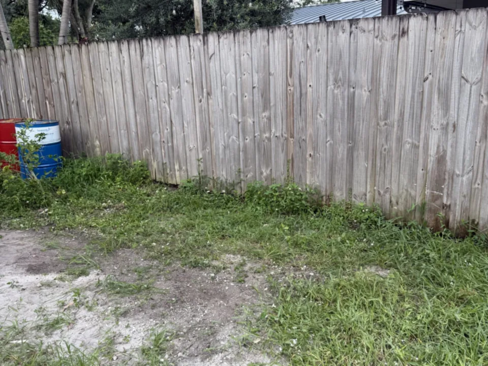 Cleared side yard raked down to bare ground