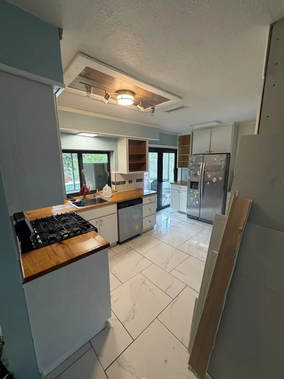 Kitchen with cabinets, counters and appliances before the gut