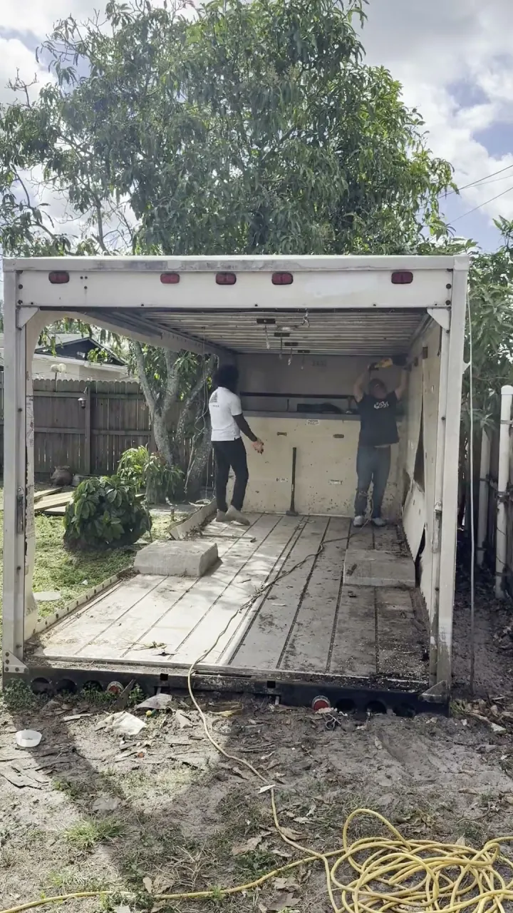 Time-lapse of the crew taking apart a shed built from a box-truck body